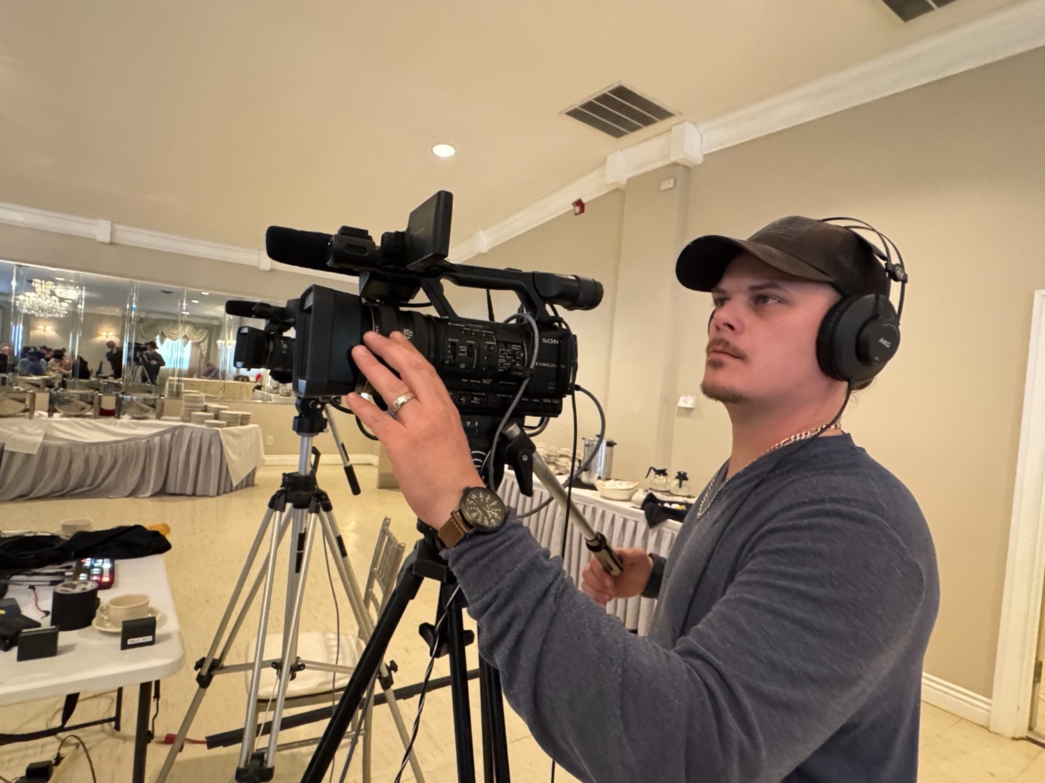 Camera operator filming a live event