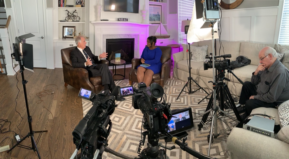 Legacy interview being filmed in a living room
